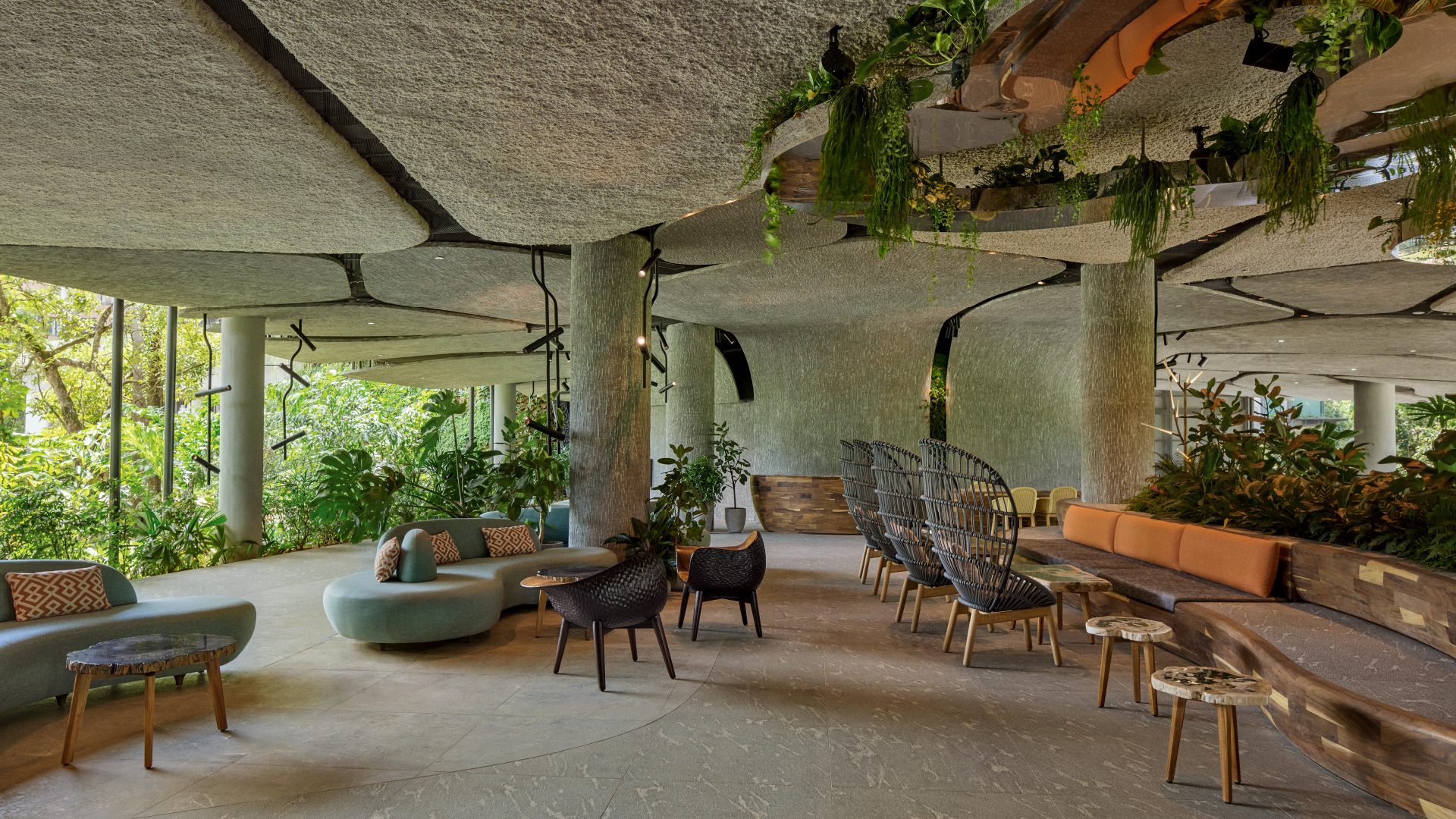 The Mandai Rainforest Resort by Banyan Tree emphasises harmony with the rainforest while offering modern amenities.